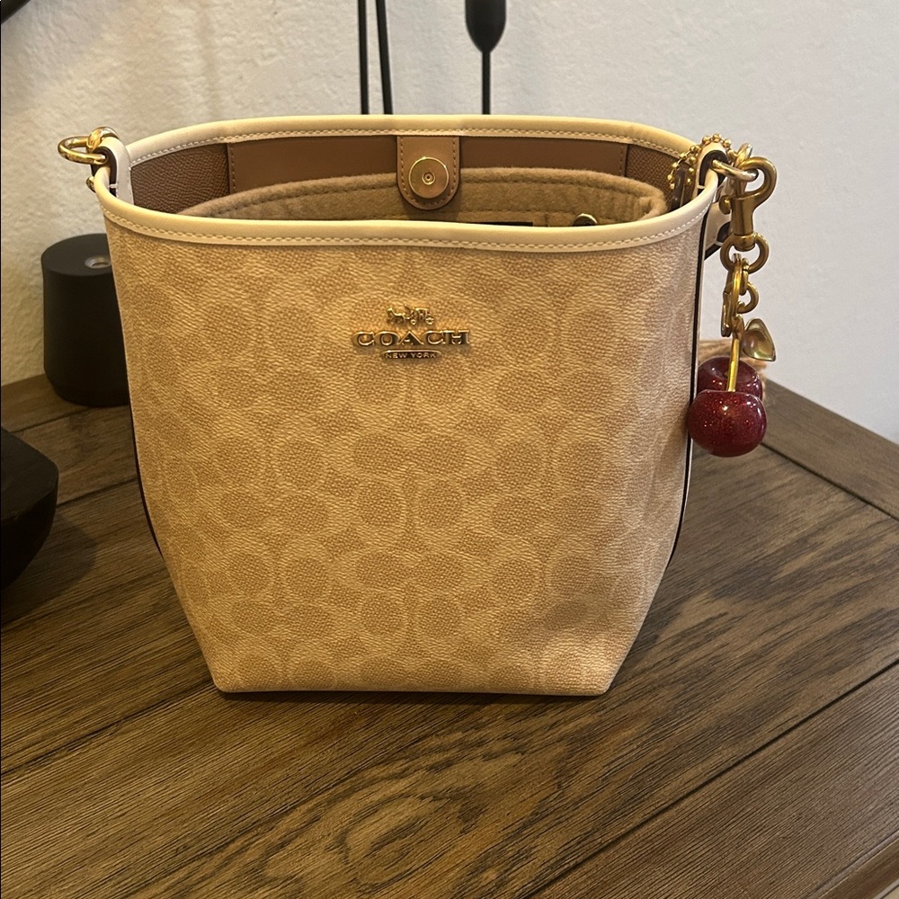Coach Tan Bucket Bag with Cherry Charm